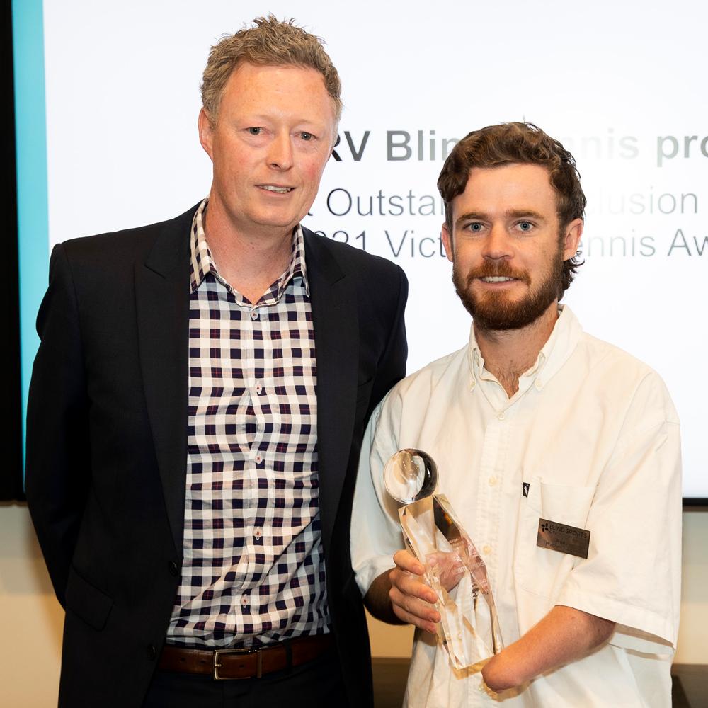Riley Thompson, BSRV Program Support, accepting the Most Outstanding Inclusion InitiativeVictorian Tennis Award received for the BSRV Blind Tennis Program